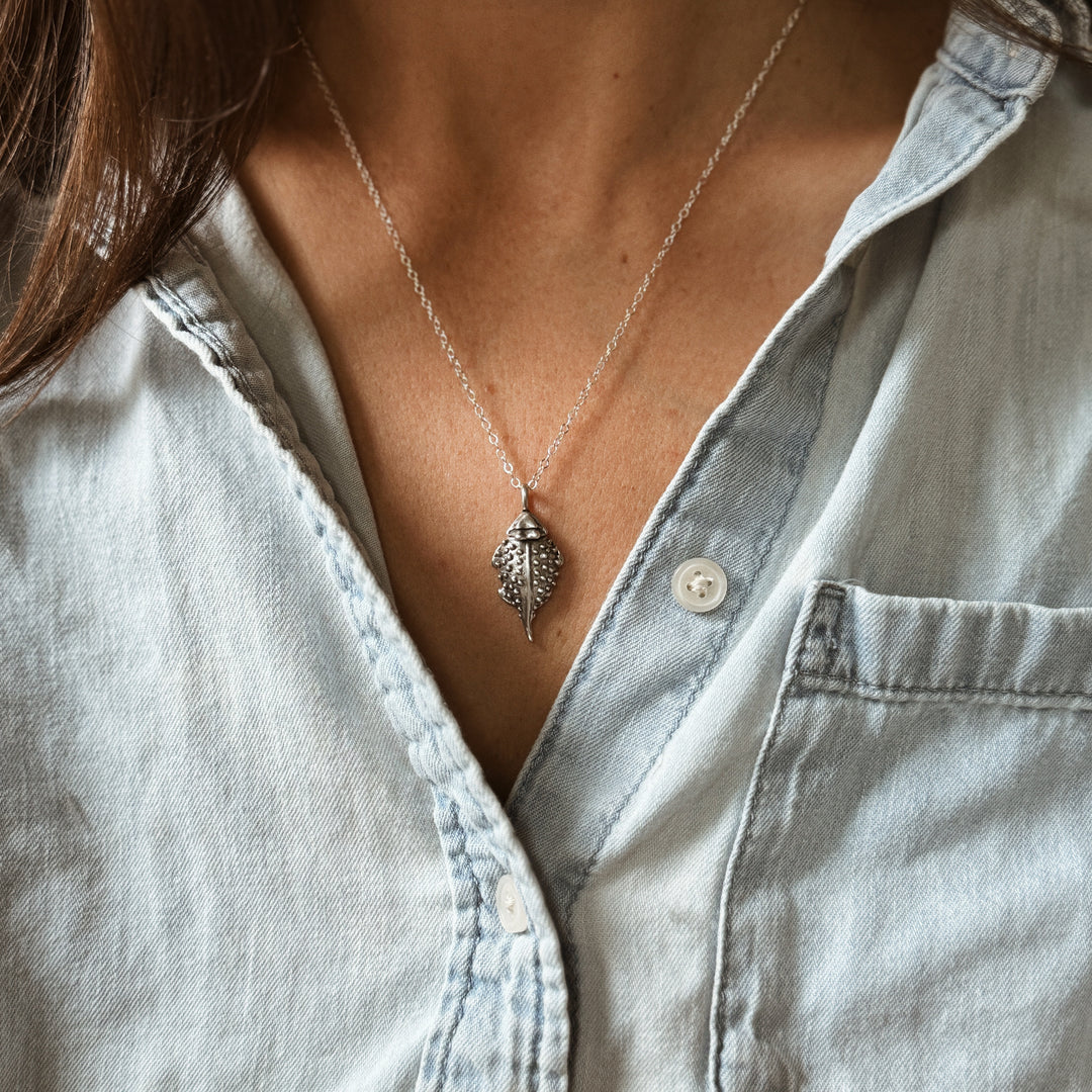 Person Wears the MIMOSA Handcrafted Horned Toad Pendant in Sterling Silver