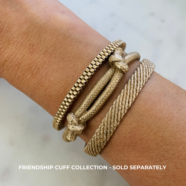 Woman Wears the MIMOSA Handcrafted Friendship Bracelet Collection in Bronze