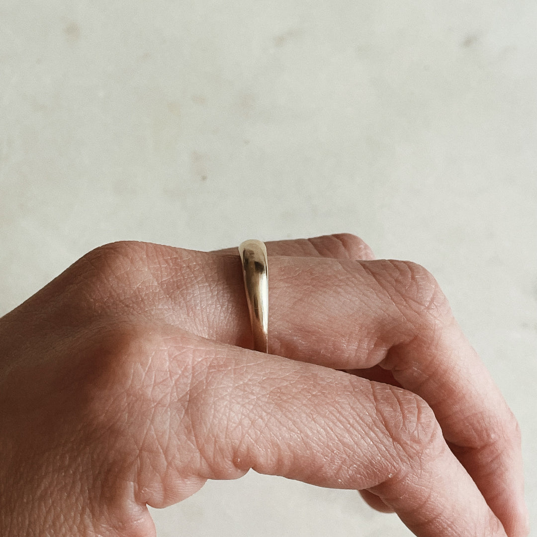 Person Wears a Dainty Dome Ring in 14K Gold