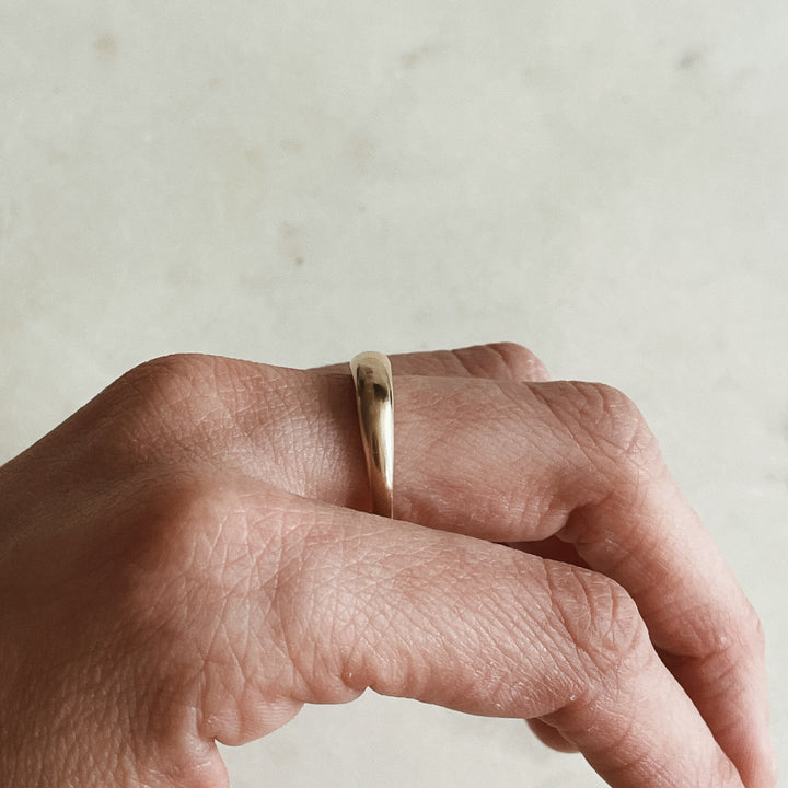 Person Wears a Dainty Dome Ring in 14K Gold