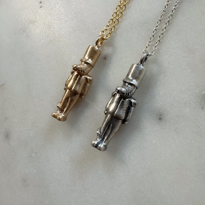 nutcracker necklace in bronze and sterling silver
