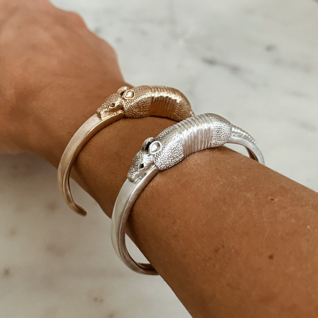 Woman Wears the MIMOSA Handcrafted Armadillo Bracelet in Bronze and Sterling Silver