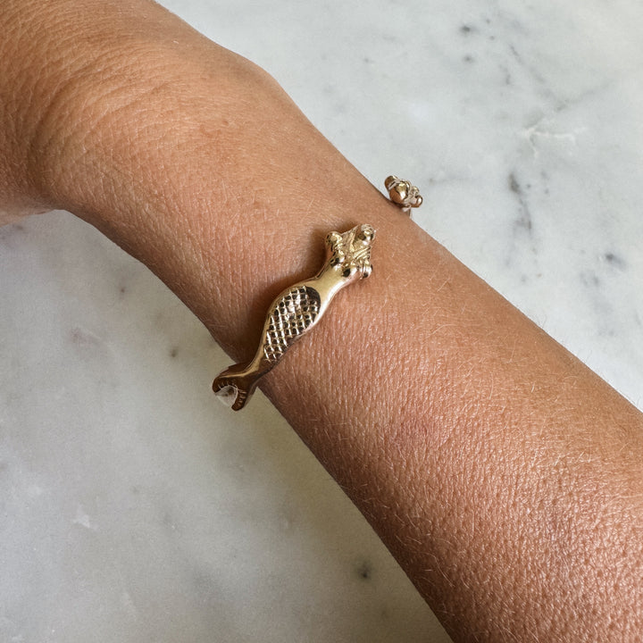Person Wears the MIMOSA Handcrafted Mermaid Bracelet in Bronze