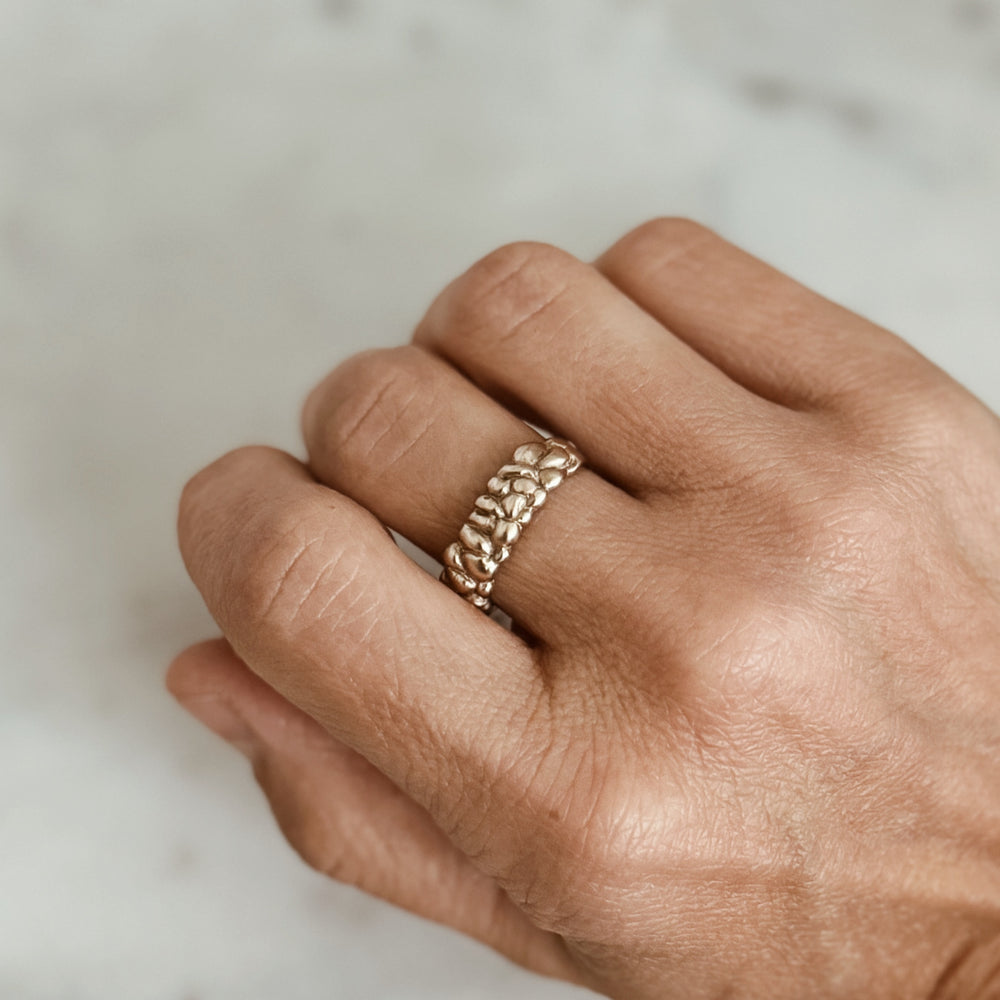 Person Wears the MIMOSA Handcrafted Osage Orange Ring in Bronze