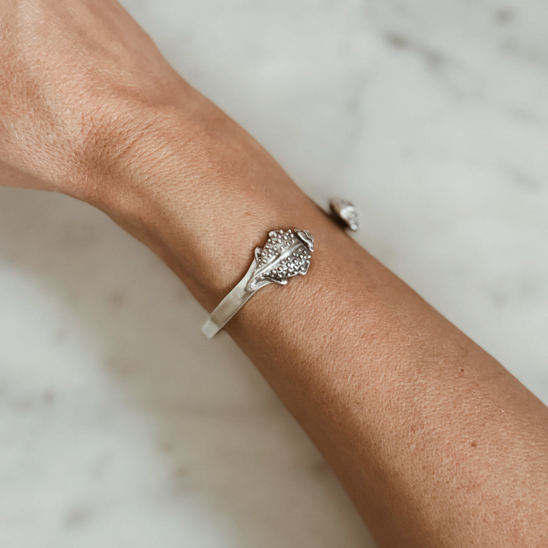 Woman Wears the MIMOSA Handcrafted Horned Toad Bracelet in Sterling Silver