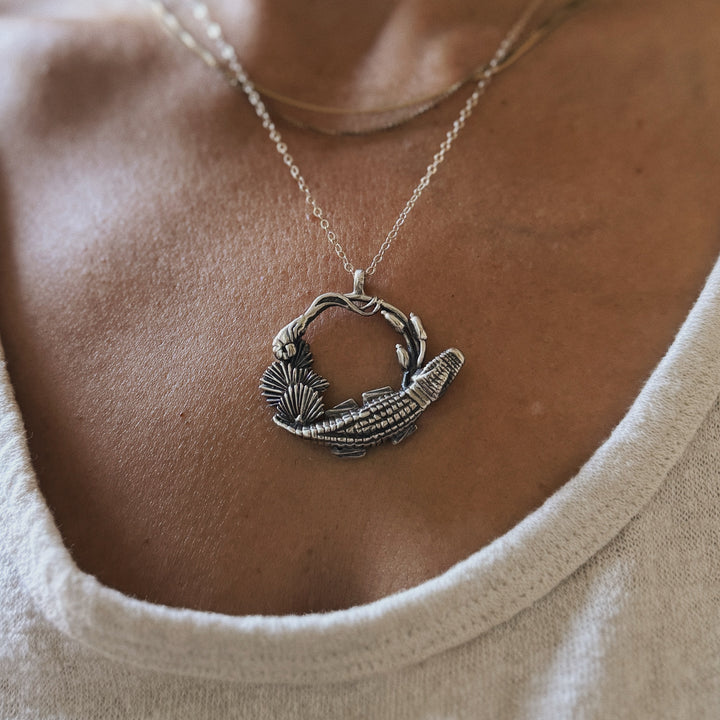 Woman wears Plein Wild Swamp-Inspired Pendant from MIMOSA Handcrafted