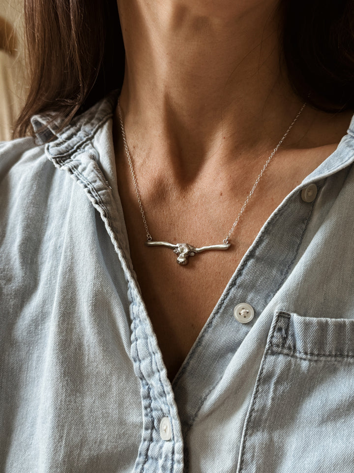 Woman Wears the MIMOSA Handcrafted Longhorn Bar Necklace in Sterling Silver