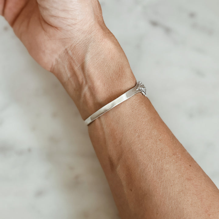 Woman Wears the MIMOSA Handcrafted Horned Toad Bracelet in Sterling Silver