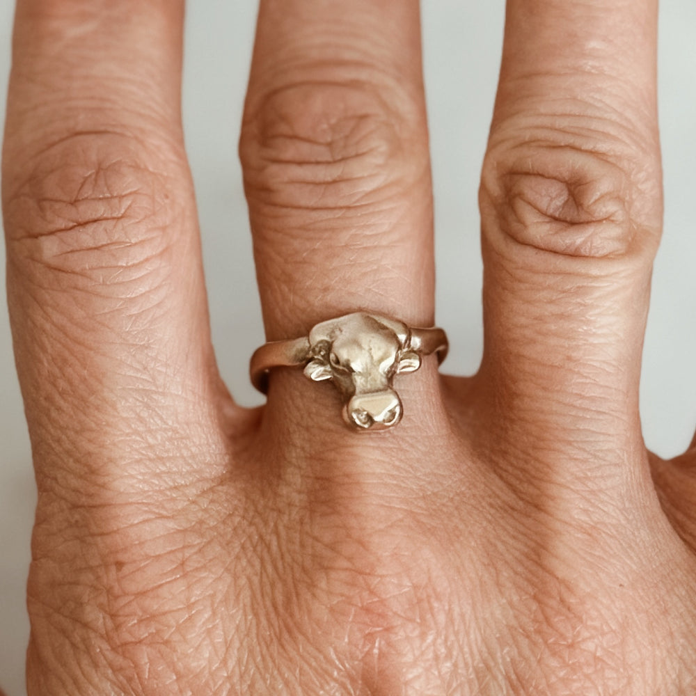 Person Wears the MIMOSA Handcrafted Longhorn Ring in Bronze