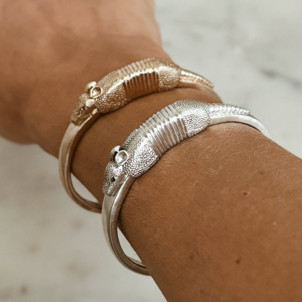 Woman Wears the MIMOSA Handcrafted Armadillo Bracelet in Sterling Silver and Bronze