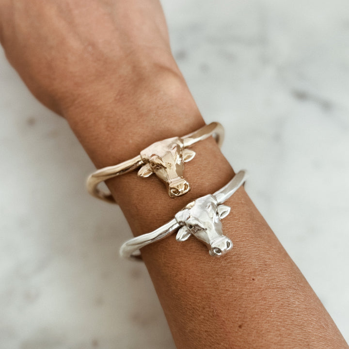 Person Wears the MIMOSA Handcrafted Longhorn Cuff in Bronze and Sterling Silver