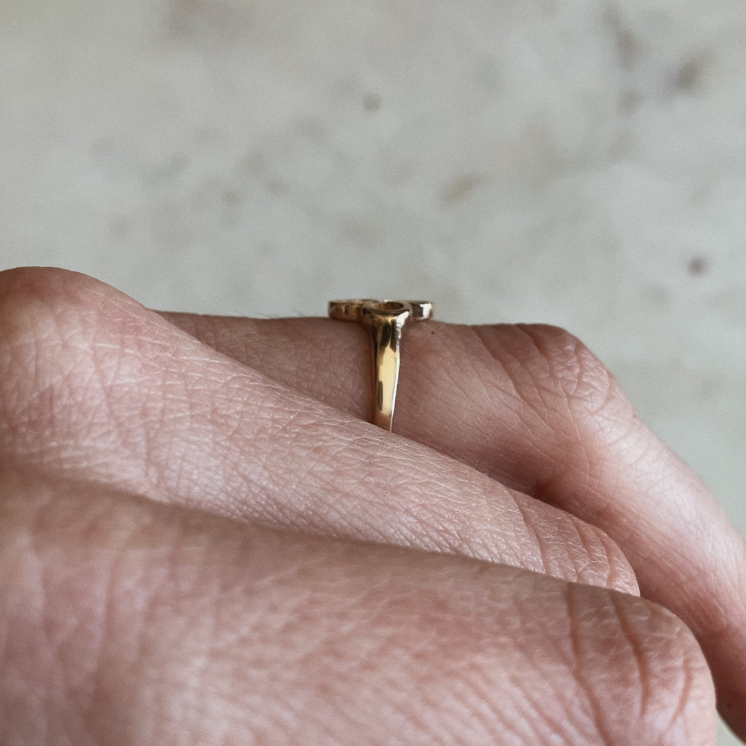 Person Wears 14K Gold Ring with Quatrefoil Design 