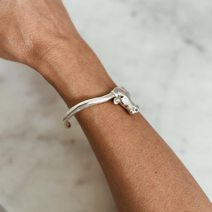 Person Wears the MIMOSA Handcrafted Longhorn Cuff in Sterling Silver