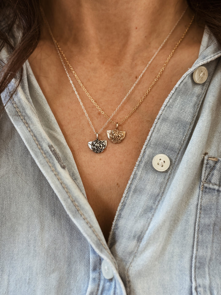 Woman Wears the MIMOSA Handcrafted Small Camellia Flower Necklaces in Bronze and Sterling Silver