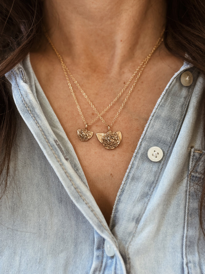 Woman Wears the MIMOSA Handcrafted Large and Small Camellia Flower Necklaces in Bronze