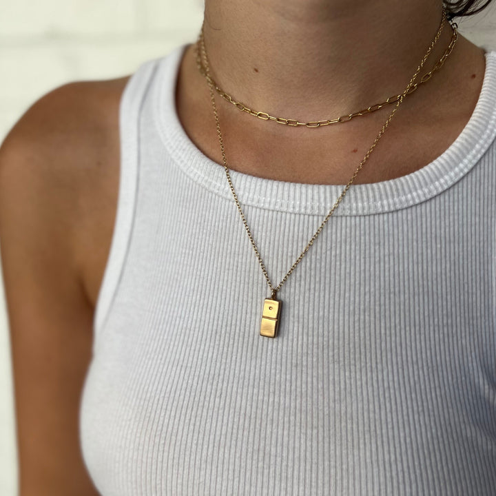 Woman Wearing Handcrafted Domino Pendant Necklace