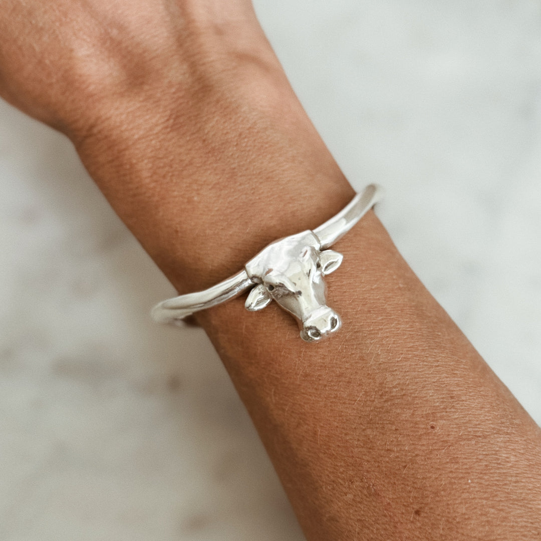 Person Wears the MIMOSA Handcrafted Longhorn Cuff in Sterling Silver