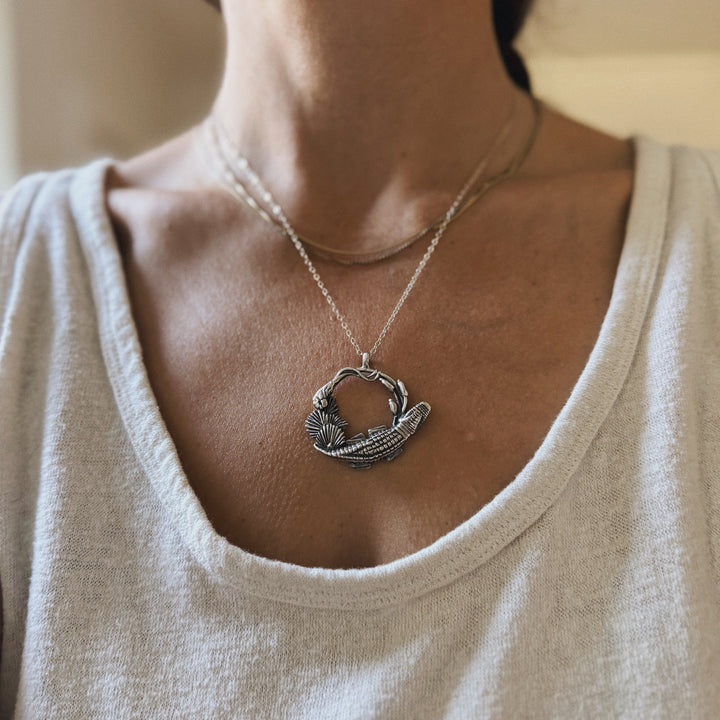 Woman wears Plein Wild Swamp-Inspired Pendant from MIMOSA Handcrafted