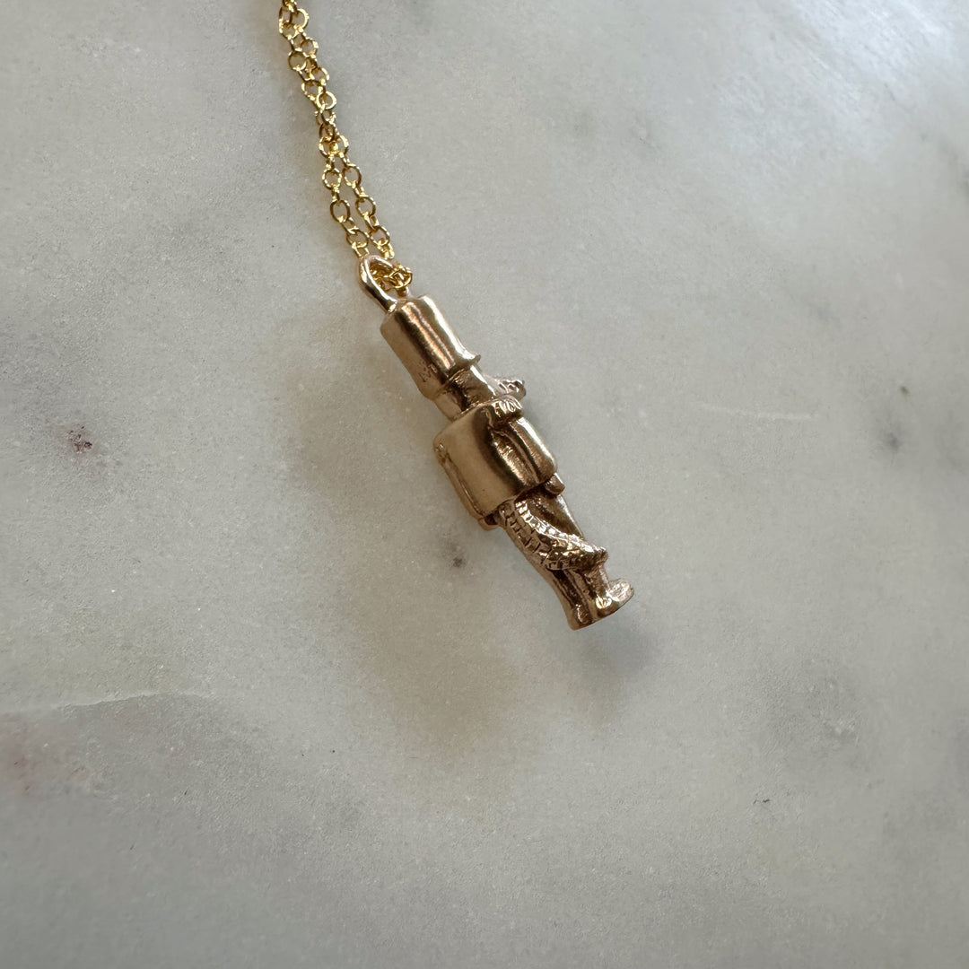 nutcracker necklace in bronze