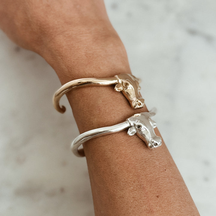 Person Wears the MIMOSA Handcrafted Longhorn Cuff in Bronze and Sterling Silver