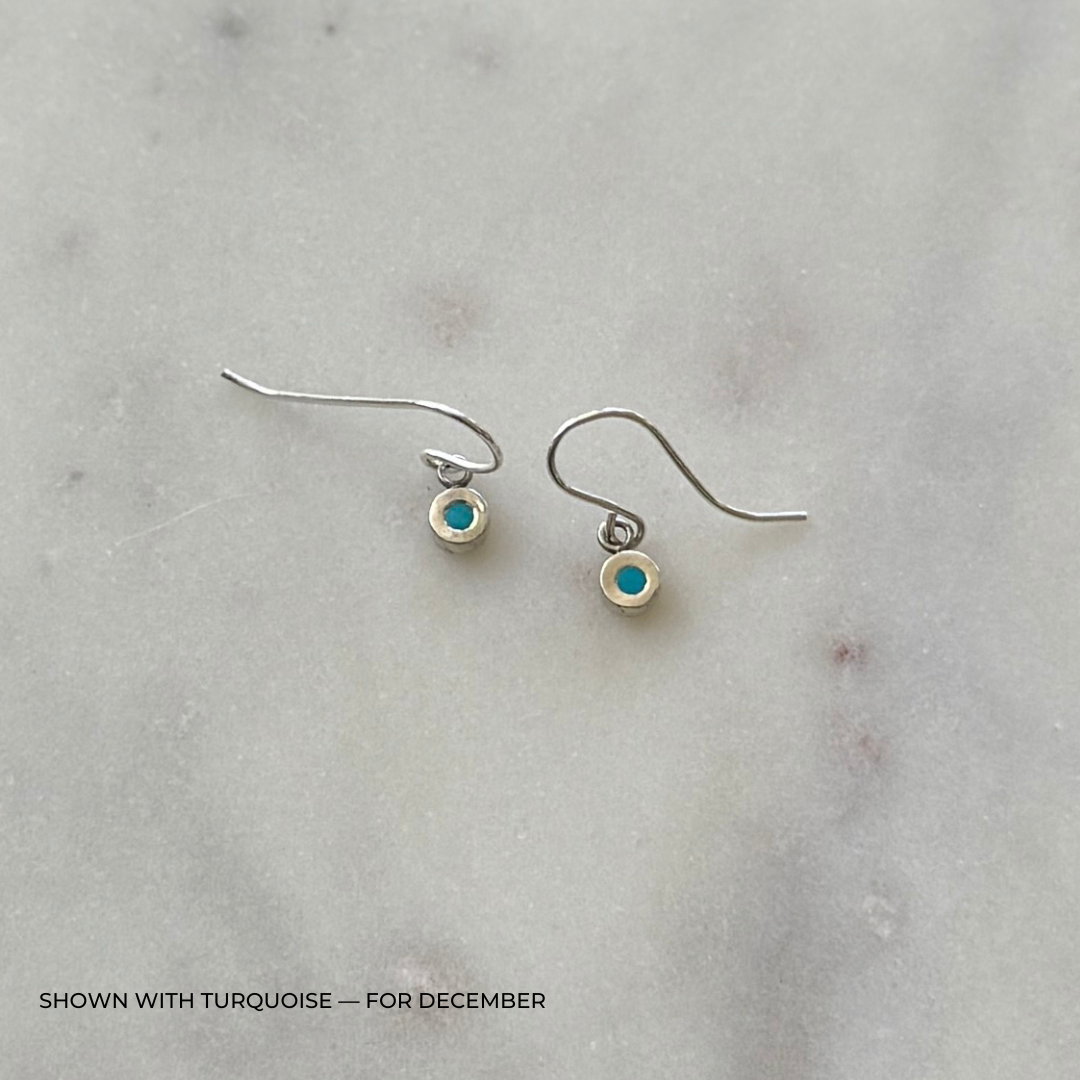 Sterling silver grace earrings with turquoise on a light gray surface