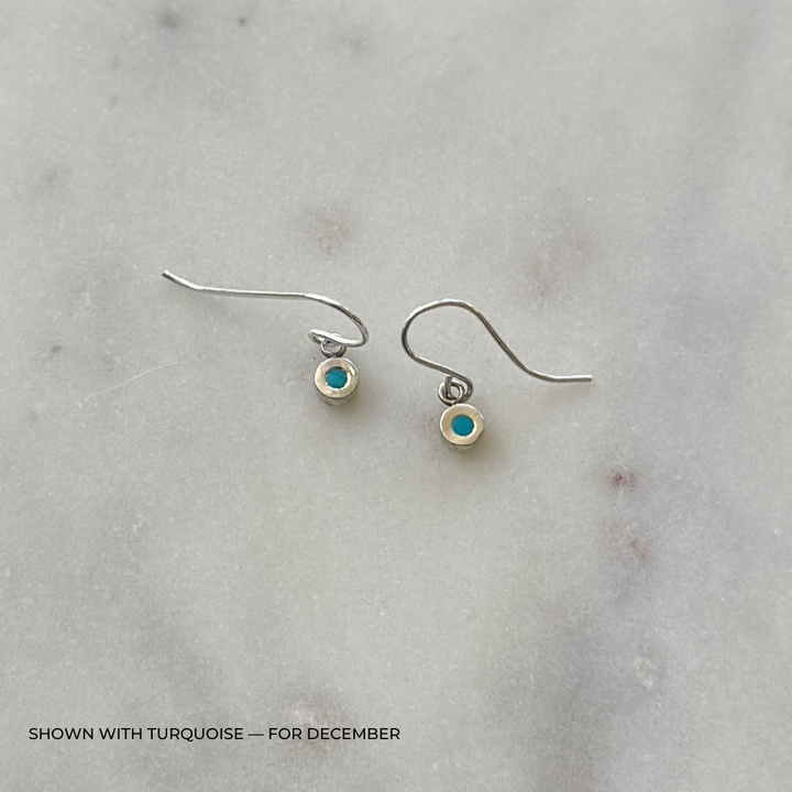 Sterling silver grace earrings with turquoise on a light gray surface