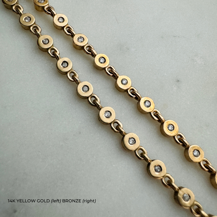 MIMOSA Handcrafted's Tennis Bracelet, the Gracelet with Diamonds, in 14K Yellow Gold on the Left and Bronze On the Right.