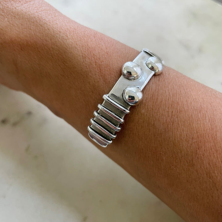 Woman Wearing Handmade Sterling Silver Tactile Cuff With Different Textures