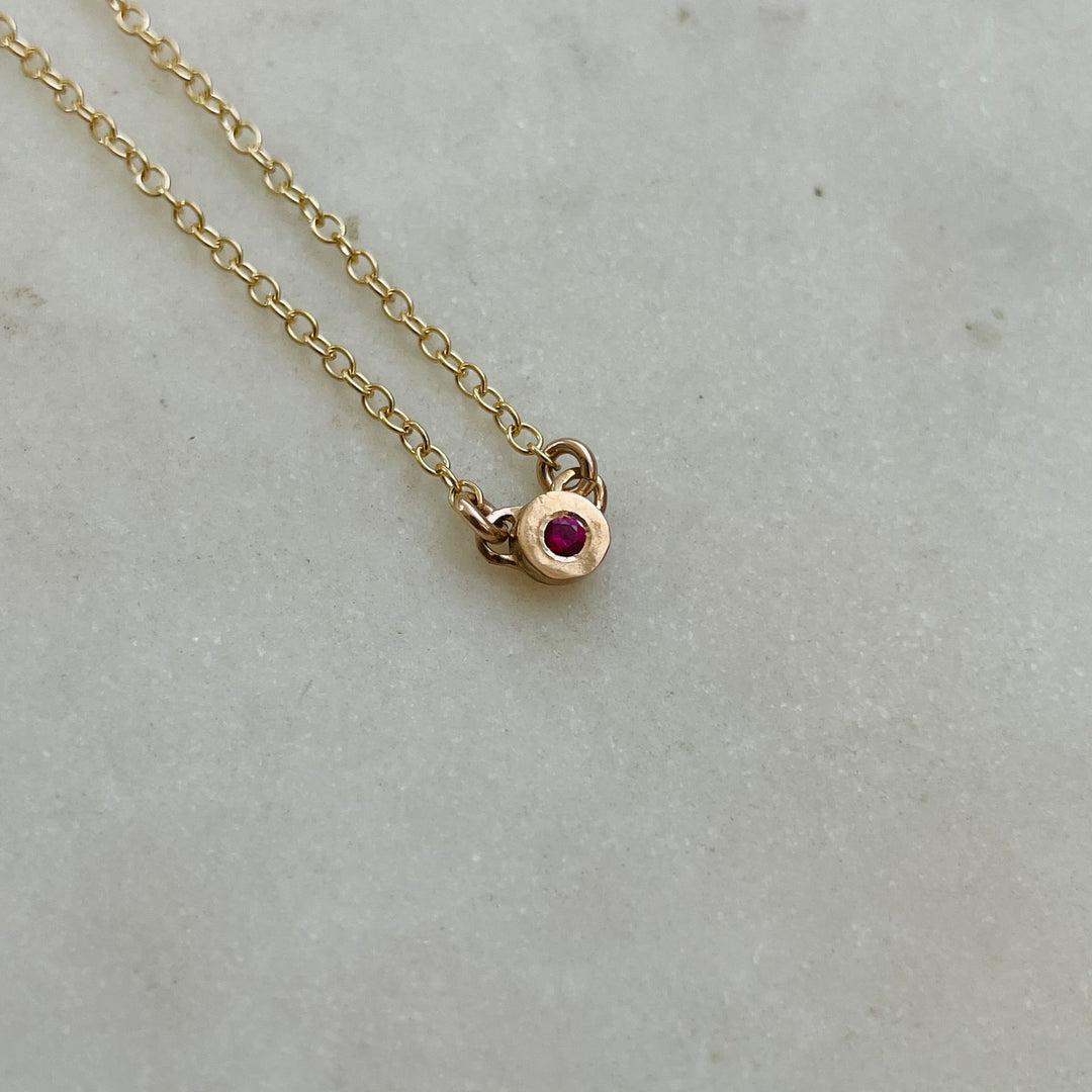 Handmade Bronze Grace Pendant Necklace With Ruby Birthstone