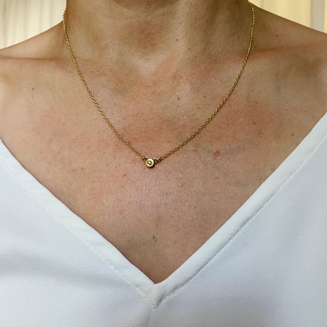 Woman Wearing Handmade Bronze Grace Pendant Necklace With Peridot Birthstone