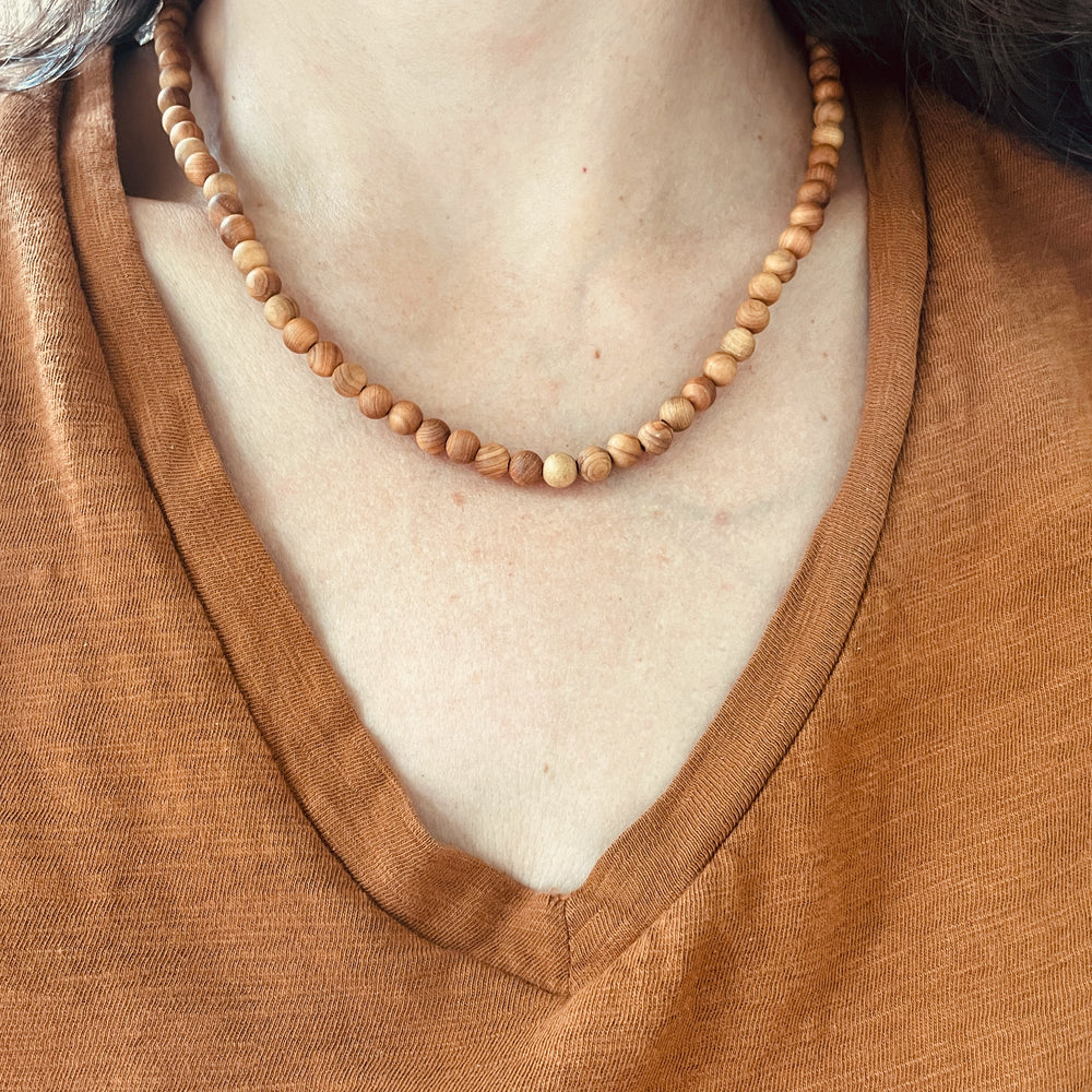 Woman Wearing Sandalwood Beaded Necklace