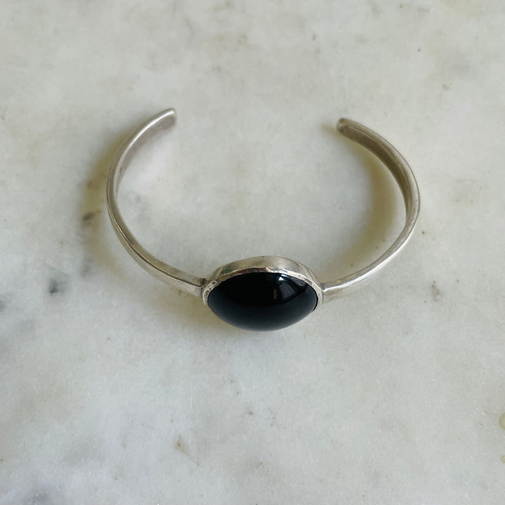 Side View Of Sterling Silver Greta Cuff Bracelet With Black Onyx Stone