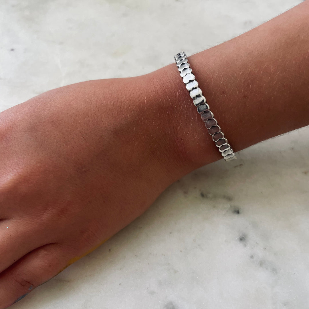 Handmade Sterling Silver Child Sized Heart To Heart Cuff Bracelet Worn By A Nine Year Old Girl