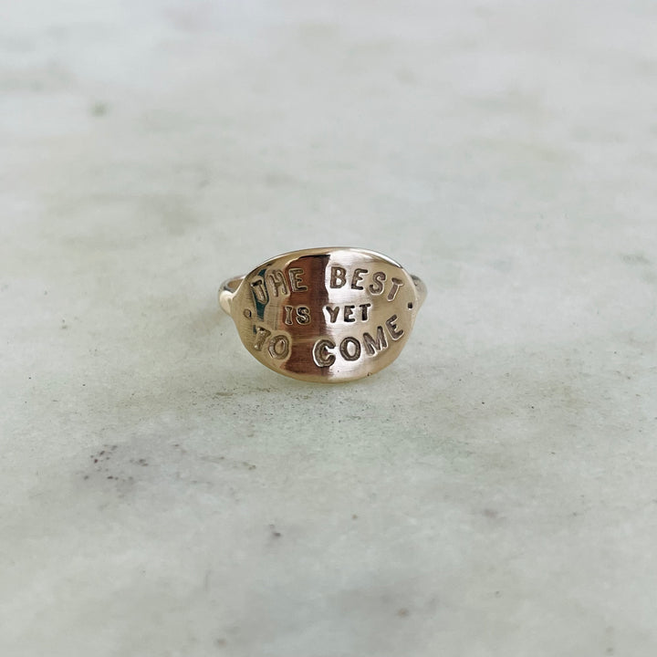 Handcrafted 14K Yellow Gold Ring With The Words "The Best Is Yet To Come" Stamped Into The Oval Face