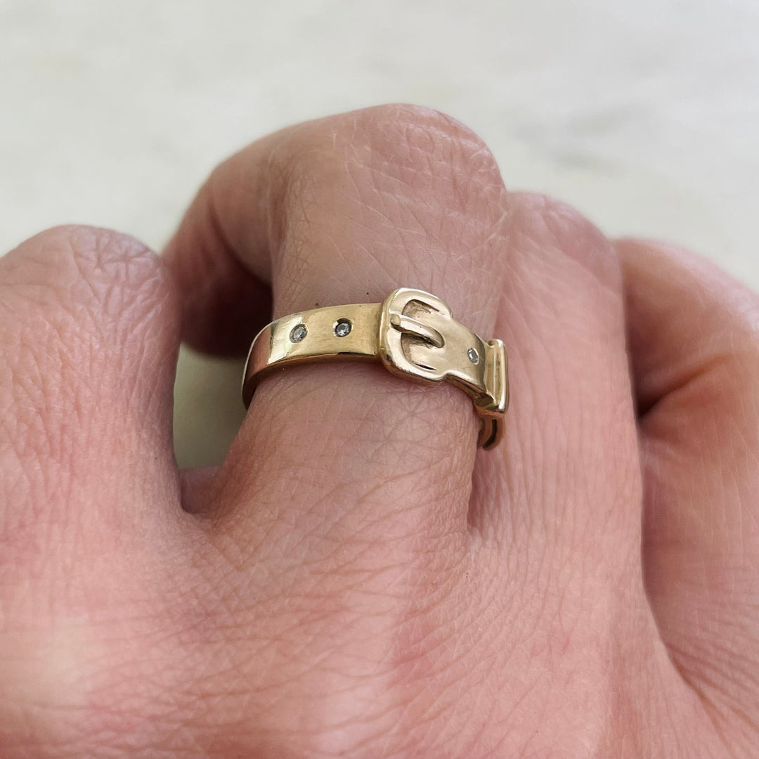 Woman Wearing A Handcrafted 14K Solid Yellow Gold Belt Ring With Four Small Diamonds