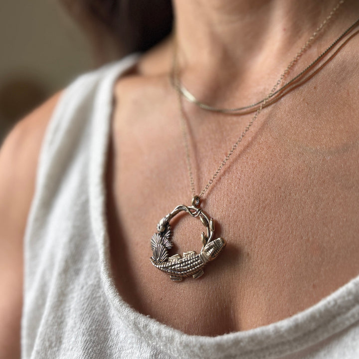 Woman Wears Plein Wild Swamp-Inspired Pendant from MIMOSA Handcrafted