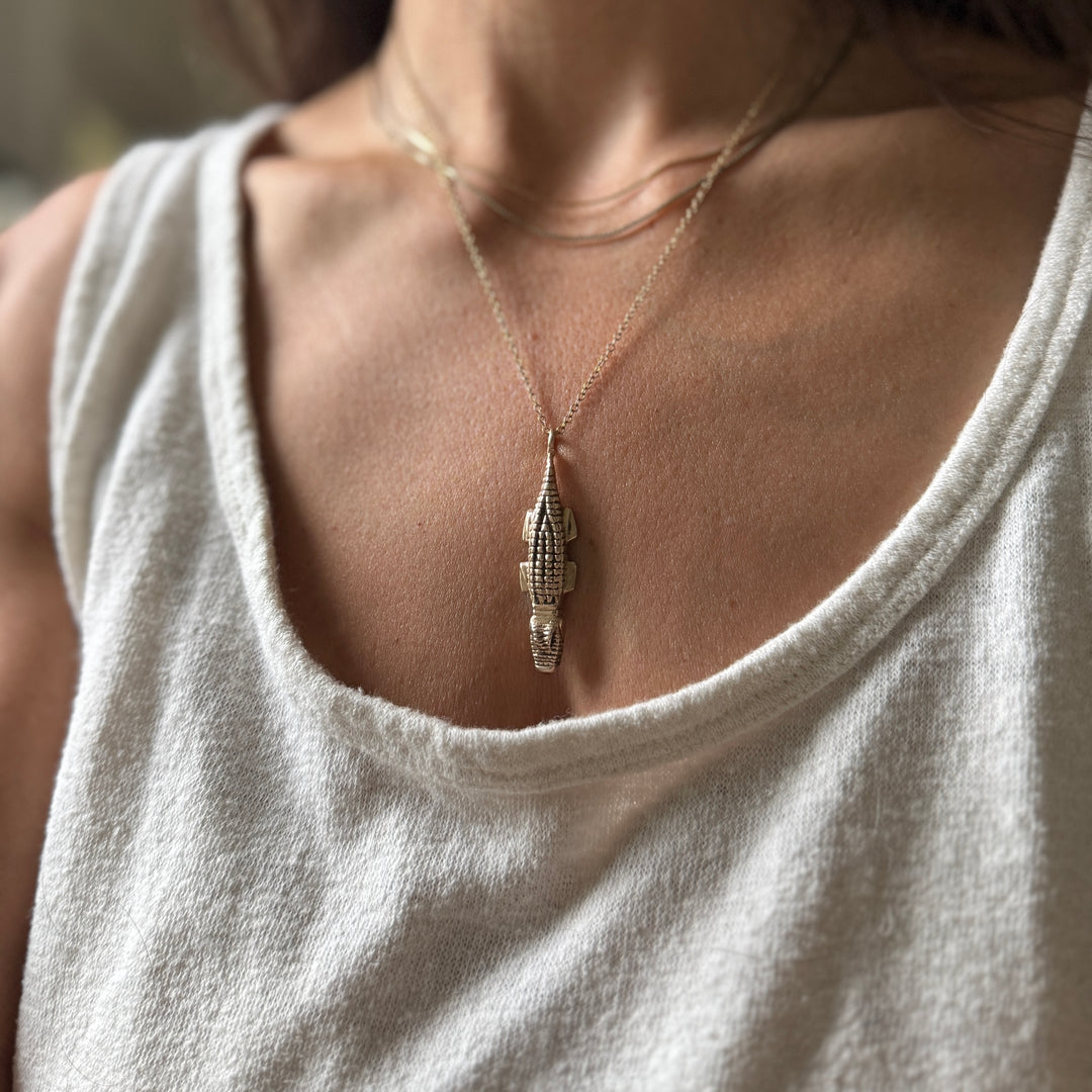 Woman Wearing Handcrafted Bronze Alligator Pendant Necklace