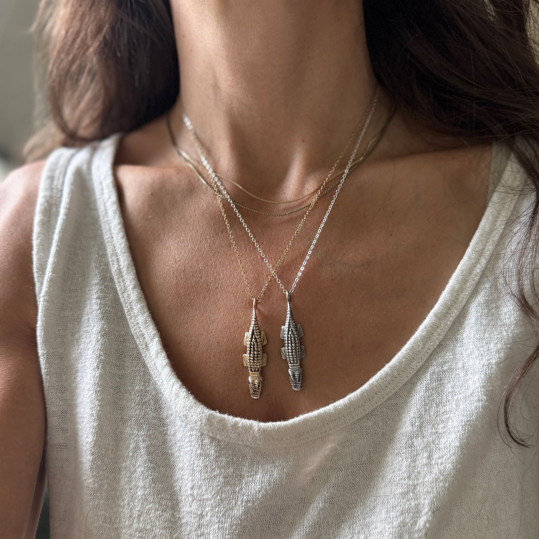 Woman Wearing Handcrafted Bronze and Sterling Silver Alligator Pendant Necklace