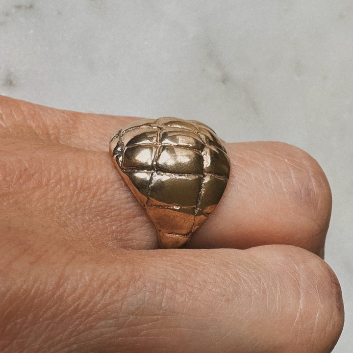 Woman Wearing Handmade Bronze Alligator Skin Ring on middle finger