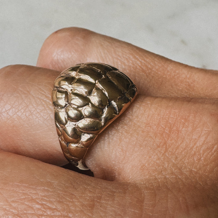 Woman Wearing Handmade Bronze Alligator Skin Ring on middle finger