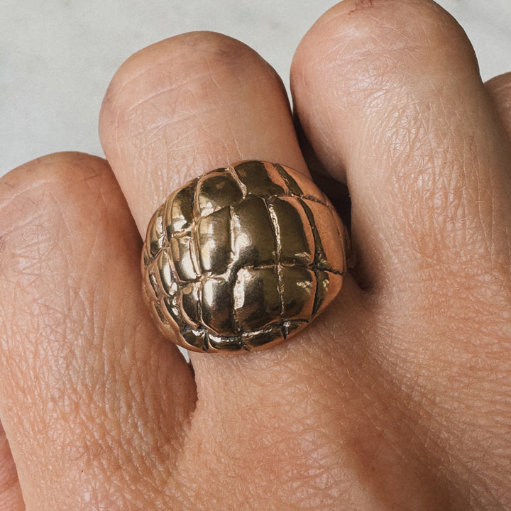Woman Wearing Handmade Bronze Alligator Skin Ring on middle finger