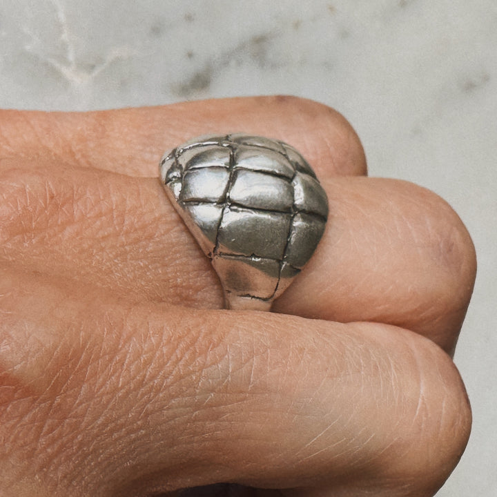 Woman Wearing Handmade Sterling Silver Alligator Skin Ring on middle finger