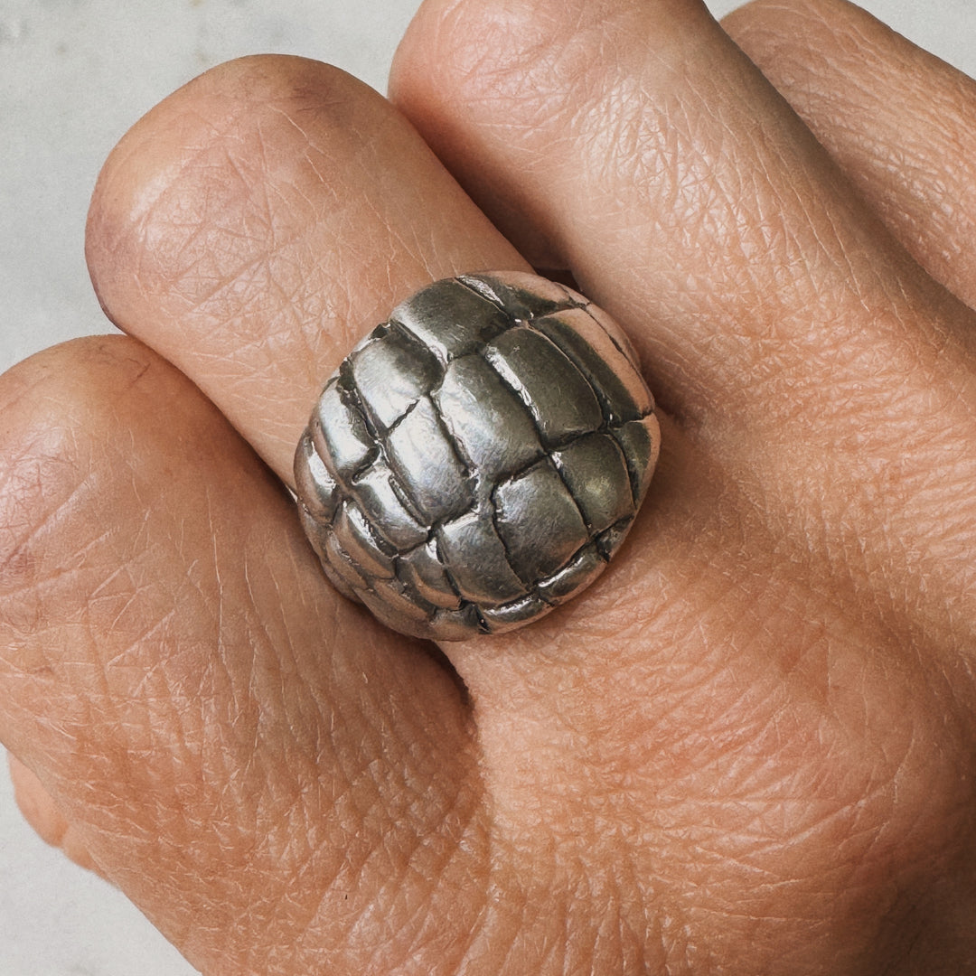 Woman Wearing Handmade Sterling Silver Alligator Skin Ring on middle finger