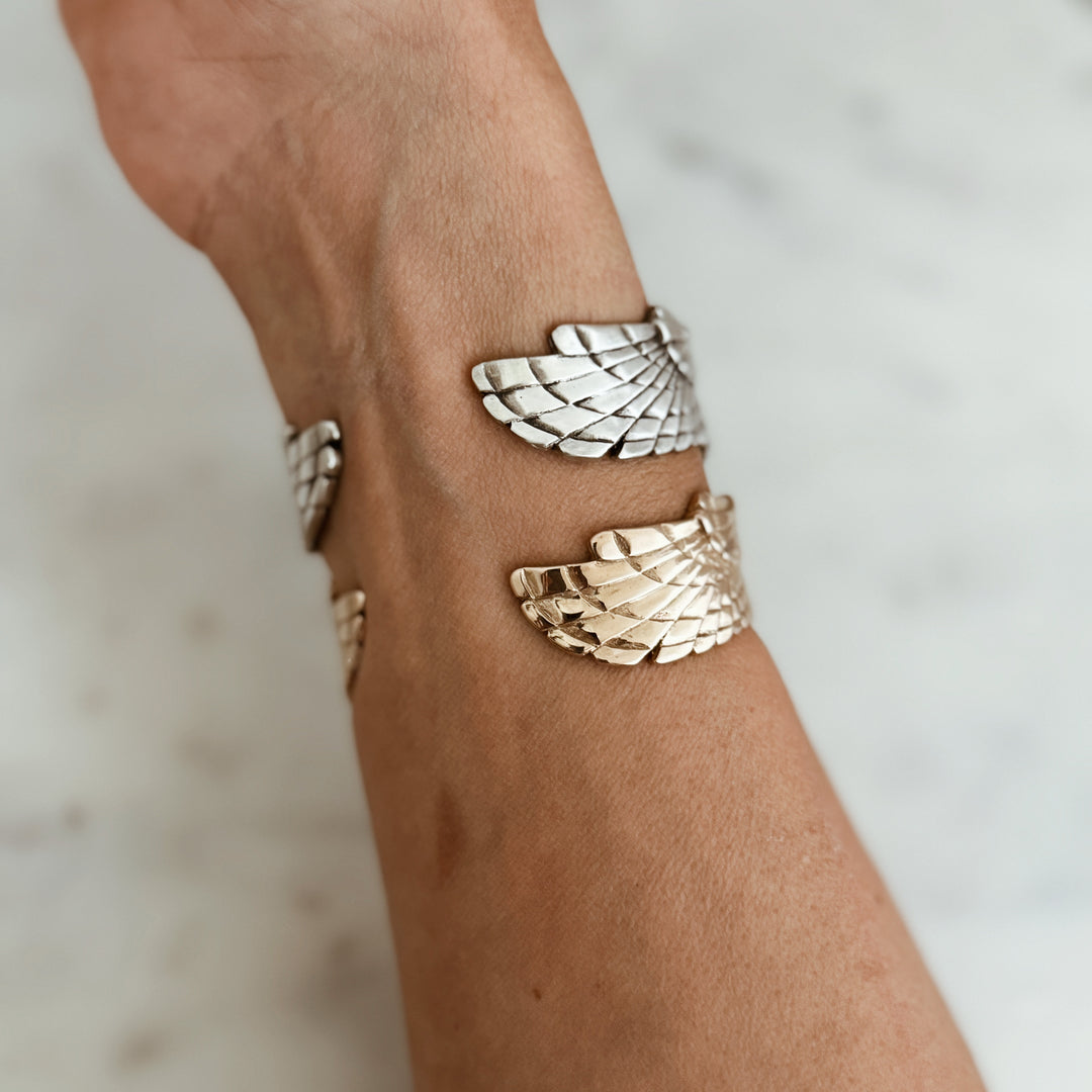 Person Wears the MIMOSA Handcrafted Owl Cuff in Sterling Silver and Bronze