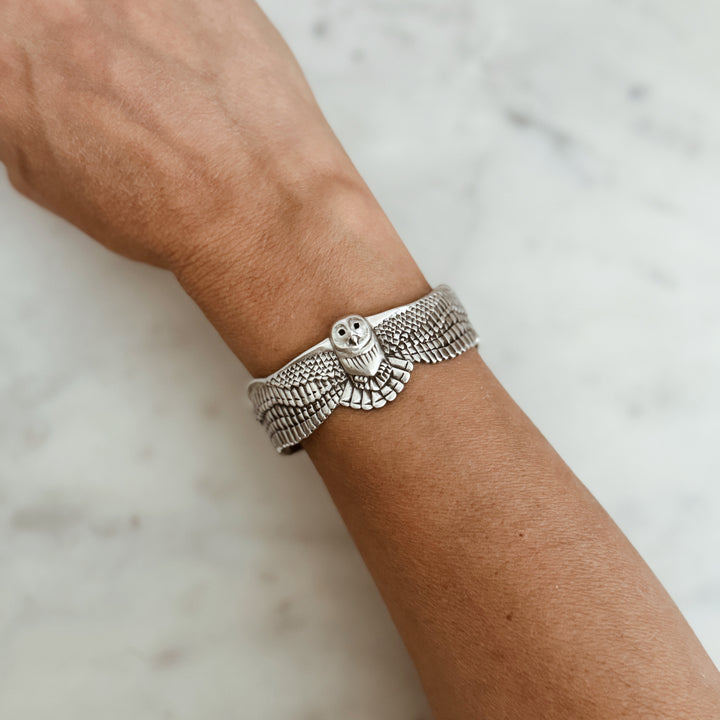 Person Wears the MIMOSA Handcrafted Owl Cuff in Sterling Silver