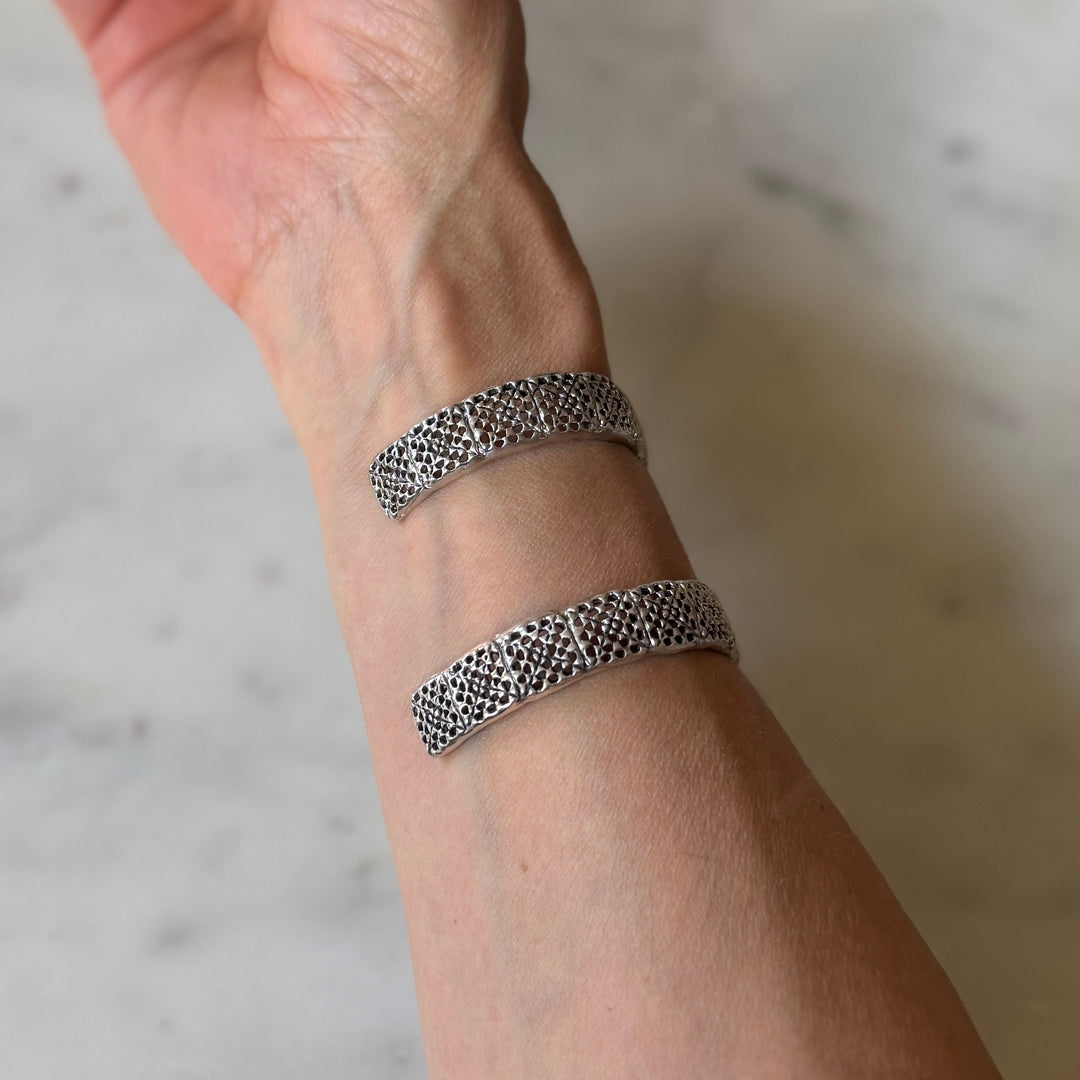 Person wears handmade granny square bracelet in sterling silver by MIMOSA Handcrafted