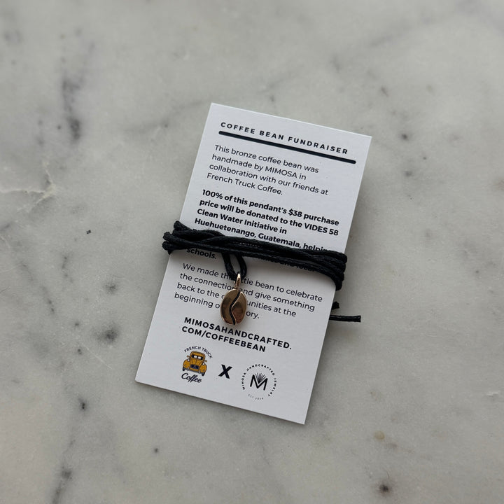 Bronze Coffee Bean Pendant on Black Cotton Cord from MIMOSA Handcrafted