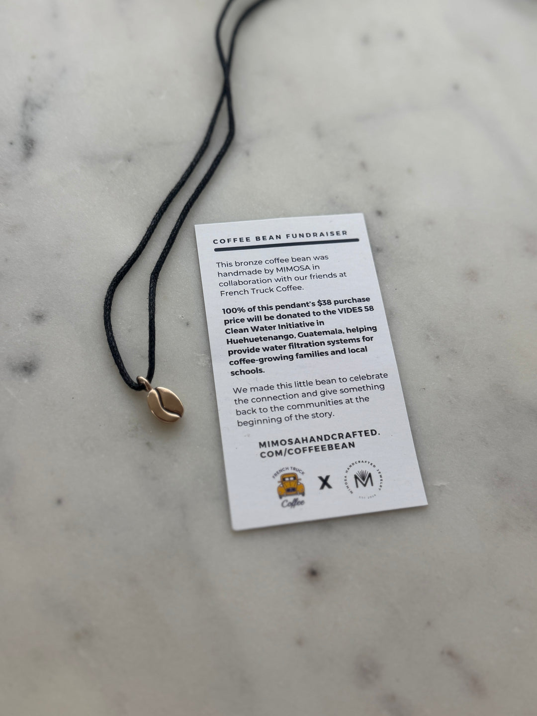 Bronze Coffee Bean Pendant on Black Cotton Cord from MIMOSA Handcrafted