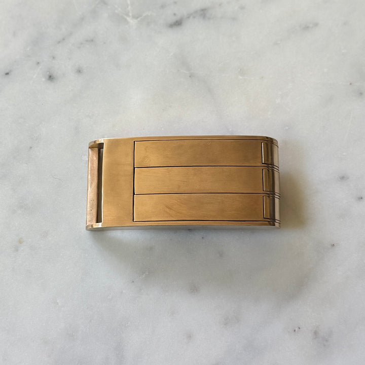 THE BELT BUCKLE