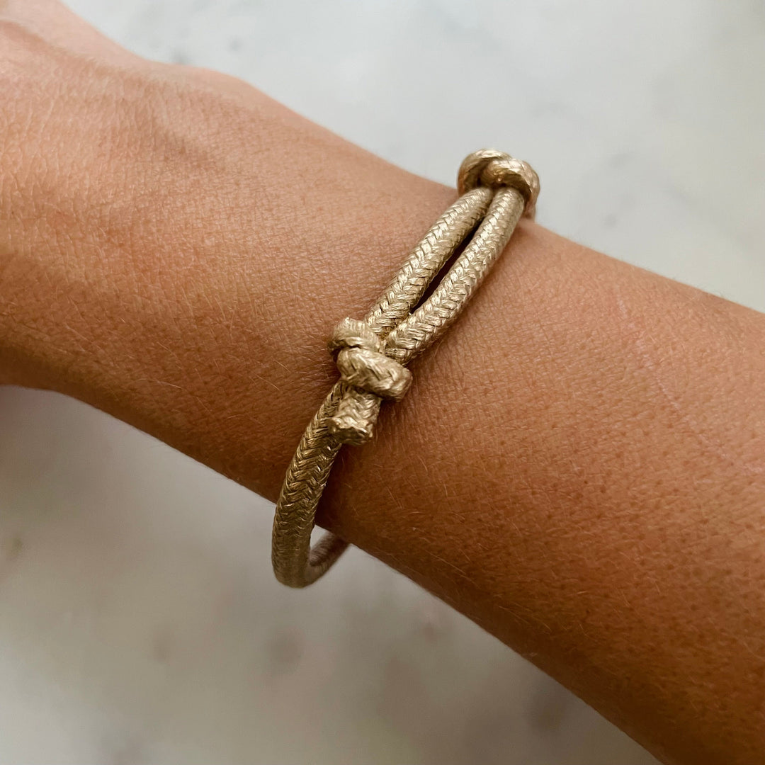Woman Wears the MIMOSA Handcrafted Bronze Friendship Bracelet Named Corrie